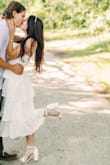 I bought this for engagement pictures and was unsure of how it would photo with having so many layers. I was pleasantly surprised! My photographer was so excited to shoot the dress and I felt amazing. I'm only 5'4 but the length worked well for being a midi style. - Taylor H.