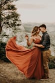 I wore this dress for my engagement photos in Yosemite at sunset, and it was incredibly perfect. I ordered a small AND a medium, but honestly both fit. The small was a bit more exposed, and I ended up going with the medium (despite this review saying I bought the small). There is a bit of elastic around the back hem to make it more stretchy to your size. There's a lot fabric in the skirt which makes for beautiful photos, but definitely be prepared to wrestle with it in outdoor settings.
One thing I did run into was that the small arrived stained and the eye loop by the zipper was barely hanging by a thread. Although the medium was a better choice for what I wanted, the small arriving in such bad shape completely eliminated it as an option. Lulus was able to reserve a small in the dress to be sent to me in case I really did want the small, so they handled it well.
Highly recommend! (photography credit abeckcaptures) - Bri N.