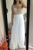 Like most, I had to postpone my wedding and always loved this dress, so I finally bought it. The beading is gorgeous, I loved the open back, and the skirt material is thick - this is a quality dress at an unbeatable price! Had I not already spent too much on my actual wedding dress, I would've kept this one and had it altered to fit just right, but I went with something more casual for this year. I still think about this dress and wish I could've made it work. - Amanda M.
