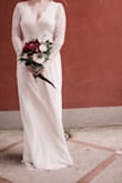 I wore this dress for my wedding - the lace on top was nice quality and the XS small fit super snug so that everything stayed together during the event. I loved the long sleeve look and the back received compliments. It's lightweight and comfortable and I saved so much going this route. - Holly L.