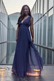 This dress was beautiful for my engagement photos but I sized down from my normal medium to a small and it was still look large in the bust. I had to use double sided tape to make it work but nonetheless it did. - Savannah T.