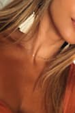 Such a cute and dainty gold necklace! Love how you can adjust it to make it like a longer necklace or higher up, like a choker. - Daniella C.