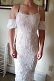 Cute dress a smidge tight in the arms bit and a bit loose in the mid section. But I wouldn't change sizes. - Kendra T.