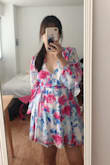 Looks Exactly like picture and cute in person. The fabric is thin and flowy, I wore it in 93F weather and it wasn't hot. In terms of length, I didn't feel it was particularly short, maybe because I'm not so tall(5'3). I think the length is totally enough when you're standing, but if you were to sit or lay down I'd def wear another shorts underneath which I did when I went to picnic so I didn't worry about it at all! The first time I wore it out I immediately got compliments so I think it's a successful purchase :) - Jinlu M.