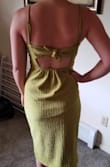 Looovvve the back of this dress. The color is stunning. You will definitely want to go braless or with petals. The slit is high but they overlap so it isn't very concerning moving around. Very happy with my purchase. - Kendra T.