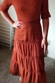 Spot on with the rust orange color. A bit longer length than my normal style but I just love it so much. If you don't mind having a slip underneath it is worth it. - Kendra T.