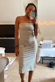 I sized down to an XS (I'm usually in a small) after reading some of the other reviews and I'm glad that I did! This fits like a glove. The material is thick and comfy, I can easily wear this without a bra. Very stylish. - Aliyah B.