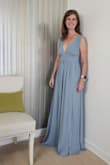 I read every review before ordering this dress because I won't wear a maxi that doesn't go all the way to the floor.  This dress is so long, I would have to have it altered.  Actually, instead of altering the hem, I would have the shoulder seams altered, pulling it up higher. If you are over 6 ft., this dress should work! Maybe even with heels. The dress is well made and steamed out beautifully.  Sadly, I'm returning it because the wedding is more casual than this dress. I need something lighter in feeling and appearance.  This is very "bridesmaid" on me, maybe it's because I'm 60.   I have on 2-inch heels in this photo, so I think taking up the shoulders would make it the perfect length.  I planned to wear my rabbit bra tapes to give the girls some lift. - Leslie T.