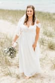 Absolutely love how this dress turned out for me. I'm "blessed" in the chest. We added detail in the front to cover more of the cleavage. We also had to shorten the dress, per usual with my shortness! I ended up wearing no shoes for our beach wedding! This dress was SO comfortable to be in all day - Maria H.
