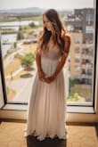 I ordered this dress because it was exactly the style I was looking for at a fraction of the price of bridal boutique dresses. I wore this for my outdoor wedding ceremony & I'm so happy with how sparkly and lightweight it is. You'd never be able to tell it cost under $300. The fit is good overall, (size 4) but just a tad snug in the rib cage area. The bodice has no stretch at all, so if your waist measurement is more than 28" I recommend sizing up. - Jennifer C.