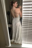 Like many brides, I completely changed my wedding plans due to COVID-19. This dress totally fit my vibe and my personality. I feel super sexy in this and I love love the back. I am a former swimmer, so I have super broad shoulders and back - so I will be having the straps adjusted just a bit to accommodate my large back and also a hem, but otherwise I'm obsessed. Also I am aware my dark red undies are noticeable, but I didn't attempt to hide them in these pics. The dress actually is lined with a nude body suit to address the see through issue! With that and my own nude panties, it should be no problem. I can't wait to wear this on my wedding day. - Kat C.