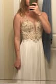 This is such a lovely dress! As much as I wanted to keep it, it was just too small in the back and I decided on another dress! The material feels like top quality and it was a good fit at the waist and chest. However, I have an exceptionally broad back and shoulders from being a swimmer - so it just wasn't quite right. I'm a size small in dresses with some forgiveness in the back, and medium if not. If you're like me with an athletic build, I suggest sizing up! - Kat C.