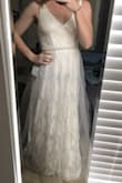 This dress really is pretty, but I didn't really love it on me. Personally, I wasn't a big fan of the skirt due to the top layer's material. If I were to keep it, I would even consider removing the top layer. I liked the top and it fit very well! I will say the length was PERFECT. I think this is a very elegant and classy dress, and the quality was excellent. If this is your style, you won't be disappointed. - Kat C.