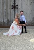 I loved this dress for my wedding! I could have gone with a small, however I am a bit busty and could not close the clasp (same with a medium). A large was great because is a wrap dress so I tied it as tight as I needed. It was very long and I had to get it hemmed (which cost more than the dress did). I loved this dress!! So flattering and great coverage, yet still lightweight. - Sheri H.