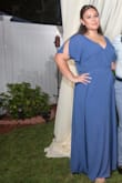 I bought this dress in an XL for my cousins at home wedding. It was very flowy and light. I didn't feel as hot as I thought I would. The only thing is i'm 5'2 and with my 5" heels it was still too long so probably be prepared to get it cut. Overall really nice dress and very flattering. - Ashley C.