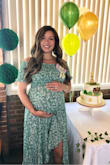 Wore this to my baby shower at eight months pregnant. I usually wear a medium and purchased a large. It was perfect and I'm sure it'll still fit post baby. It's comfortable and flowy! Got tons of compliments! - Mary K.