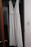 It looks beautiful (although it will need steaming) and feels beautiful! I can't wait to change into it after my wedding gown! Thank you! - Holly K.