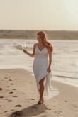This was a perfect dress for the occasion. I got the inside pulled in a bit to make it extra fitted to me, but it is not necessary. I did have to hem the dress to fit my length being we did pictures on a beach and heels were not appropriate. 10/10 recommend the dress!! - Brittany D.