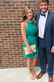 Was a little skeptical because I normally don't wear green, but I loved it! I had many compliments on this dress. Fit very well, except in the bust. There was a little room on both sides, but fit perfectly in the waist and length. If I would have sized down it would have been too tight on the waist. Material shows any type of liquid spilled on it, but dried quickly! - Jordyn O.