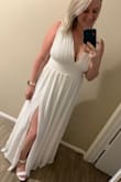 I took advantage of the free returns and ordered a medium & large because I was torn between the sizes. Highly recommend doing that if undecided! But I loved this dress. I ordered it as a last minute elopement dress. The large fit great, it is snug on the waist part but for me that was fine because it had the perfect fit. I just got it altered - hemmed because I'm a short and stitched up the boobs an inch or two just so it wasn't so busty. I didn't wear a bra either. - Chelsey D.