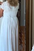 Other reviews stated this ran small so I ordered a medium and I'm glad I did. It's a beautiful fit and feels great to wear.  I bought it to get married on the beach in the summer. It's perfect. The gauzy feel and lots of beautiful lace is luscious. The tie in the back is stringy so I changed it out with a long silky ribbon. The lace is elegant - Nancy M.