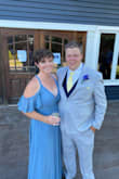 I loved my dress. I was torn on getting a medium or large but the beauty of it being a wrap dress was that it is essentially adjustable. I'm glad I got the large though, the bust was my biggest worry and it couldn't have fit more perfect there. I was also worried that it being a wrap dress would come undone but I had zero issues once I tied it. It is a little long even when I wore heels but I never stepped on it. I loved how flowy it was. It was just perfect. - Taylor O.
