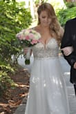 After my wedding got cancelled and we were forced to postpone our big wedding/reception to next year (thanks a lot COVID) I had to plan a whole different much smaller wedding (20 people) in 2 weeks. For the whole year I found myself looking at this dress and loving it through my computer screen. When I had to change my dress to fit the setting of our smaller more intimate ceremony I knew I wanted to get this dress. When I received it in the mail the pictures and reviews did not disappoint. It was PERFECT! I love this dress and wish there were more occasions for me to wear it. I got 2 sizes a 4 and a 2 (knowing that for some reason Lulus dresses run big I decided to go with the 2) I did have to hem the length a bit and have the seamstress remove the hanger tags because for some reason they attach them inside the sheer material so it would be showing unless you cut them out. But overall this dress blew my mind. I love it!! I would highly recommend! - Allison D.