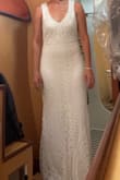 This was a last minute wedding dress after I decided my first dress wasn't dressy enough. It came in the time the shipping said. It fit perfectly except for the length and the beading pattern was beautiful!! I'm just shy of 5'3, was wearing  3 inch heels, but needed it not to drag on the ground for safety reasons (we got married on a boat). Like most dresses, it's probably more for women who are about 5'8. Normally, I'd say don't try to hem this because the pattern flows beautifully and is continuous, but I had no option. Luckily,I was able to find a seamstress who made it work and the hem change was almost totally hidden, with just 2 days to spare before my wedding. It was a little see-through also so I also had to add a full slip. Still, for the price, beautiful pattern, and timing, I was so happy with the choice and that I found this dress!! I felt beautiful and comfortable and got tons of compliments even from total strangers passing by. - Lauren D.
