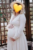 I wore this beautiful dress for my maternity photos. It's so flowy and lovely. I wouldn't recommend wearing when it's windy or wear something underneath as the wrap/slit is very open. Overall I love this dress though and so happy I purchased it! - Hannah P.