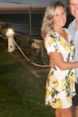 This is a lovely summer dress! I love the flowing fabric and sleeves. It does cut real low and may take it to a tailor to get a snap sewn in. - Cindy S.