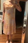 The colors in this dress are really pretty. I was not a huge fan of the neck line - I have a smaller chest and the swoop neck was not flattering. The waist is kinda loose and the shape is also not flattering - it makes me look 10-15 lbs heavier than I am. The length is also kind of awkward. I would return but it was a final sale item. - Kaela V.