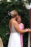 I bought this for a small pandemic wedding. I usually wear a size 8 or 10 dress. The 10 was definitely too big. I had a seamstress put in Larger cups, add more clasps in back and shorten the straps. She also hemmed it. The dress itself is gorgeous! It sparkles but it very heavy and delicate (had to do quite a bit of bead repair!) I wore it on my wedding and got a ton of compliments, but there were a bunch of small pulls in the skirt by the end of the night. - Briana L.