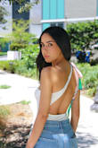 Love this bodysuit and the shoulder detail. I got the white one and it came with a matching hair band. I'm typically an xsmall/small in tops. I ordered the size small and it does fit a little wide. In my photo you can see I had to tie the top as much as possible. I think for a small, it runs big. To see more on how I styled follow me on instagram.com/maitbarri/ - Maitte B.