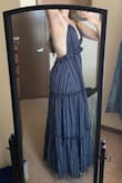 I usually go for a medium in lulus dresses, and sometimes that size is too small for my hips, but the size small in this dress works great! 
The top fits secure around my bust except when I twist a lot to the side. 
The skirt is a bit heavy for summer, so maybe better for late spring or early fall.
I'm pleased with it overall! - Amanda T.
