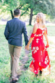 This dress was perfect for our engagement photos. I find that a small fits best in most dresses from Lulus, but the material doesn't have any give, so a medium was good for me. There was gaping under the arms that my mom had to take in for me. I've received lots of compliments on it though, and the red pops well in photos! - Samantha O.