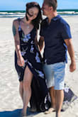 I bought this and one other dress for a beach anniversary. I ordered this in an xsmall and the other in a small. They both fit great the xsmall fits better in length. This one is a wrap dress meaning it comes on like a cape and you have to tie in on using the strings. It has a beautiful slit and is super flowy in the wind. I didn't wear a bra and it looked good although it may not be the most comfortable to keep tightened after a large meal! - Toni M.