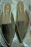 The shoes are a soft gold metallic in color. These are a really nice made shoe. I love these shoes. - Chevita T.