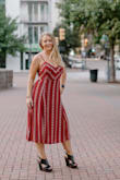 I wore this for a July photoshoot, it is flattering to the body and if the top part fits a little off you can adjust the tie back. It is lined which is nice unless its 100 degrees and outside then it sticks to the body. No fault to the dress just an observation. Most people probably won't be outside for a few hours in this dress. But would be great for early fall days. - Brandy F.