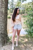 I absolutely love this top! It is so gorgeous on. It's lightweight and flowy and just so pretty overall! I ordered a small and fits perfect. Not too tight or loose. High quality material shirt. - Joan W.