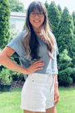 Absolutely love this top! The color and fit are perfect. The material is very nice quality yet breathable and great for summer weather. This is more of a square or boxy loose fitted crop. I was between a S and XS, however, after reading reviews and looking at photos, I went with the XS. I am very happy I did and actually ordered this top in white recently too. - Laura S.