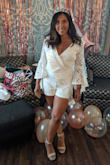 Such a great fitting romper & I usually wear a small and ordered a small & Runs true to size! I was worried that the sleeves were going to be too long because I'm a bit petite but they were perfect. I have smaller boobs so I had to pin it in the bust but otherwise, great fit. - Adriana R.