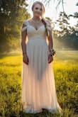 I was going to use a really simple summer dress since I didn't feel comfortable going to a bridal fitting during a pandemic. A couple weeks before the wedding I stumbled upon this site. The dress fit me so well. I am short so it was a little long but really gorgeous and I can't believe how reasonable the price is. - Kimberly R.