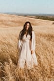 Absolutely better than I expected! I felt amazing wearing this dress. It's overall a great length, for my height. I wore a halter bralette under and it went well with it! Highly recommend. - Rosa B.