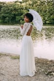 I loved it. Wish the xxs was available but I did my own alterations with the sleeves as they were a little big for me. Nonetheless, I got many compliments and I felt confidently beautiful in my dress on my big day. - Norrisa D.