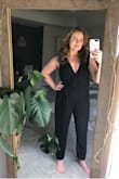I bought this jumpsuit on sale for $28 and honestly I'm still in disbelief, such a cheap outfit looks and feels SO GOOD. This suit is versatile, flattering (covers mommy pooch), and is overall so comfortable!! I rolled the cuff under and paired it with Lulus taylor black suede ankle heels, and gold jewelry for my husband's military ceremony. Get a low cut bra and safety pin the inner portion of the wrap top to the waist band for fool-proof coverage. Looking forward to wearing this with flats for more casual events. I purchased a medium, which was a tad tight initially, but after wearing it for an hour or so, everything loosened up and fell just right. New favorite outfit for sure! - Erika H.