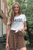 Love this! I tied the front since it is a little long. Made of a suppler soft material. - Ginevra C.
