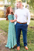 I wore this dress for my engagement photos the other night. It was 95 degrees and I didn't feel too hot because the dress is so lightweight. I wore this with a strapless bra. I'm a natural redhead so the green color really made my hair pop. I got so many compliments on this dress. I am only 5 feet tall and the length was perfect with some wedges. I loved that the dress looked romantic with the off the shoulder sleeves and was flowy with a slit in the front. It looked great in pictures. - Brenna G.