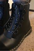 I have always wanted to own a pair of Dr Martens but thought they were kinda ugly. These were so unique. I typically wear a size 8 1/2. I went into a local journeys store to try on the 8 and 9. The 8 fit a little tight in places but I read that you want it to be that way because they stretch a little and form to your feet over time. I have worn them around the house a couple times a day for 15-30 minutes at a time for about a week now. I am in love with them!!! You can literally wear them with everything. I would recommend going down in size if you are between.
Also, it seems you can remove the front zipper piece and just use the laces. I have yet to try it yet because I love the zipper look. - Katy B.