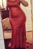 I ordered this in a Medium, Large was not available when I ordered and based on reviews, it seemed it would work out fine. It definitely does work, fits really snug, but being that I got this to make it into a Jessica Rabbit dress, it kinda needed to be snug lol That being said, it is hard to get on and off hahaha but when it is on its fine (I haven't tried sitting though) A Large probably would have still been my preferred size.
The only reason I deducted 1 star is because the sequins shed... I tried it on the one time, in my room, and I am finding red sequins all over my house, even after vacuuming! - Ashley M.