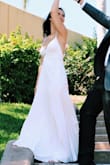 Bought it with no reviews, wish I had ordered a smaller size. I had no time to get alterations done so I twisted the inside and pinned the straps in the back. It still looked beautiful though and I got a ton of compliments. I love the fabric. - Hannah R.